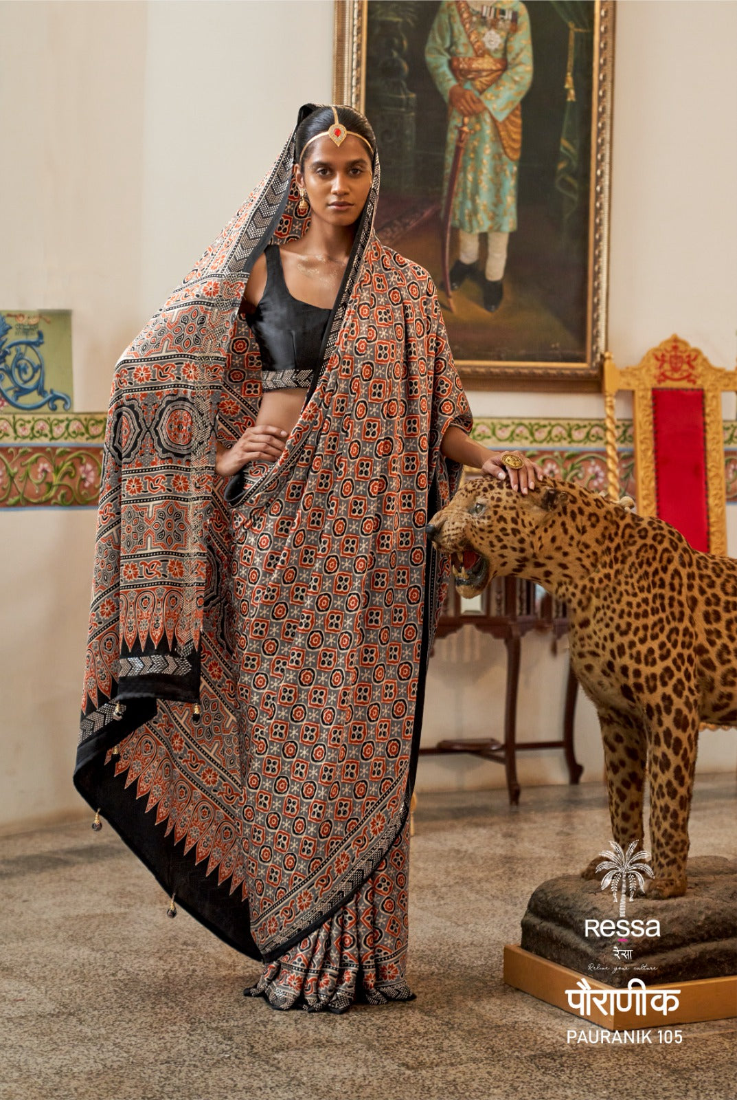 PAURANIK-Elegant black and rust saree with traditional Ajrakh-inspired geometric prints