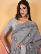 ZARI MAHAL-Elegant Silver Grey Linen Saree with Intricate Black Floral Woven Border
