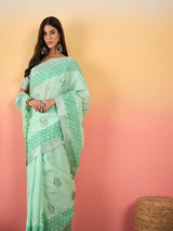 ZARI MAHAL-Mint Green Linen Saree with Elegant Floral Woven Border & Subtle Motif Work