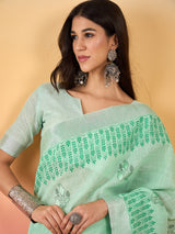 ZARI MAHAL-Mint Green Linen Saree with Elegant Floral Woven Border & Subtle Motif Work