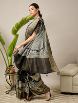 ADHIRA-Elegant black saree featuring intricate traditional mythological and folk art inspired prints
