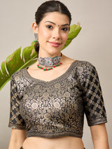 ADHIRA-Elegant black saree featuring intricate traditional mythological and folk art inspired prints