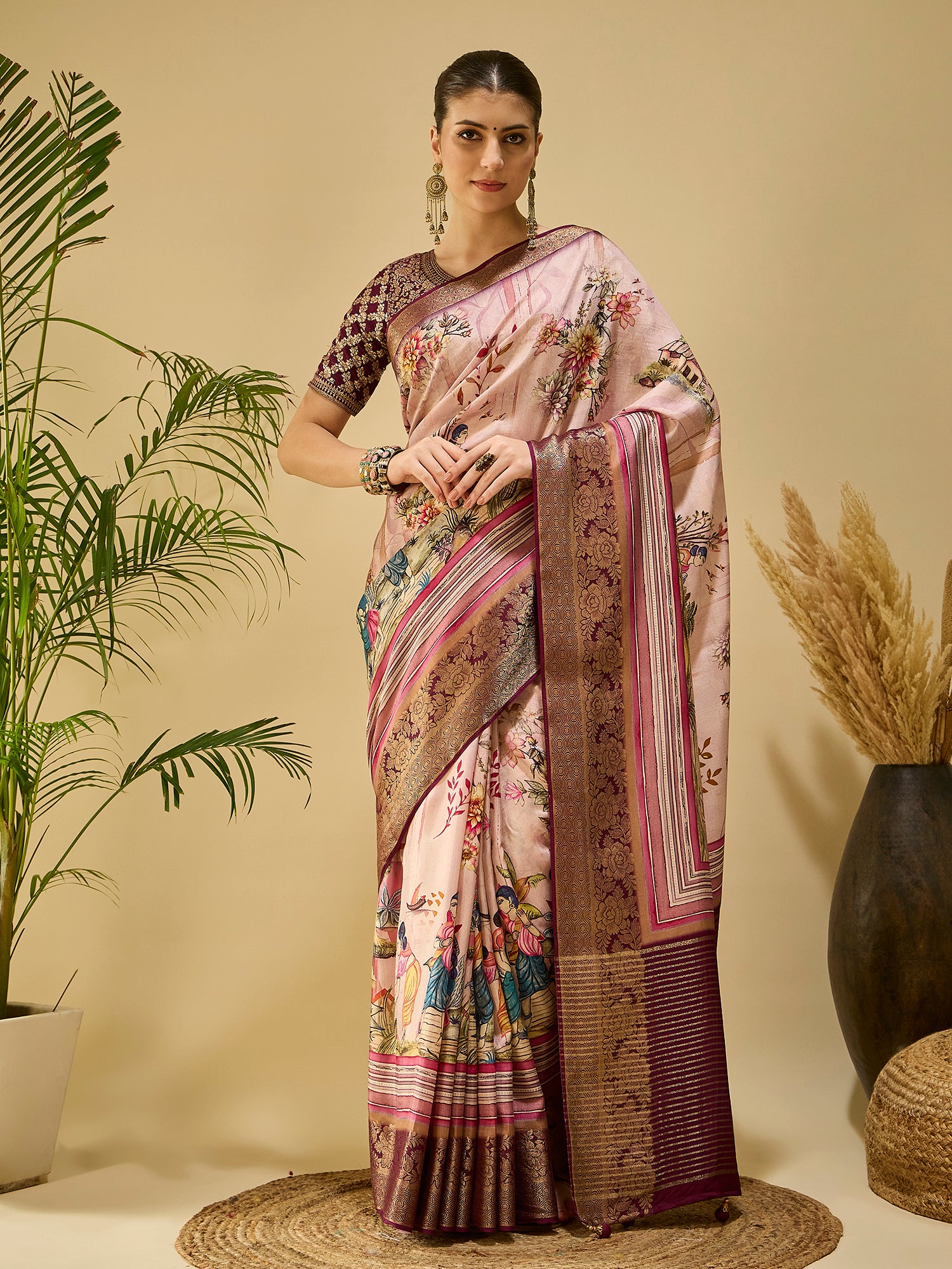 ADHIRA-Elegant blush pink saree with artistic floral and cultural figurine print design