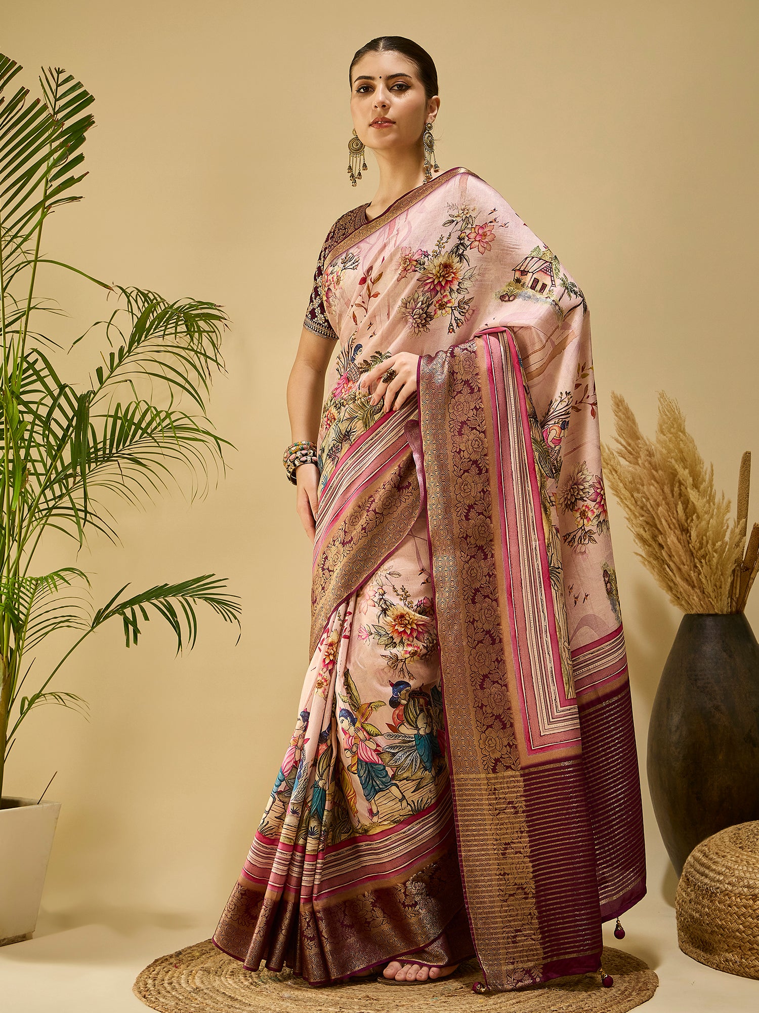 ADHIRA-Elegant blush pink saree with artistic floral and cultural figurine print design