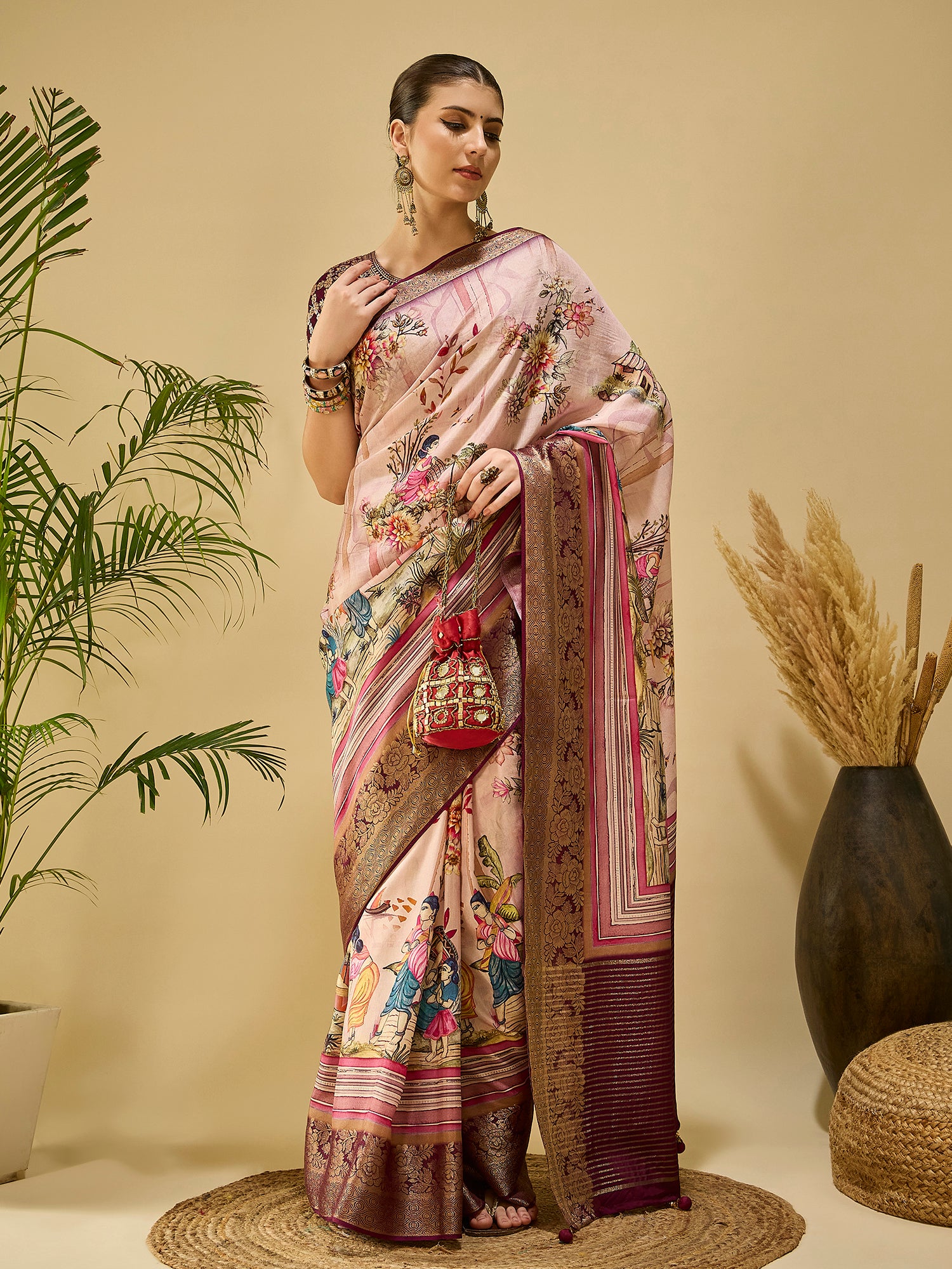 ADHIRA-Elegant blush pink saree with artistic floral and cultural figurine print design