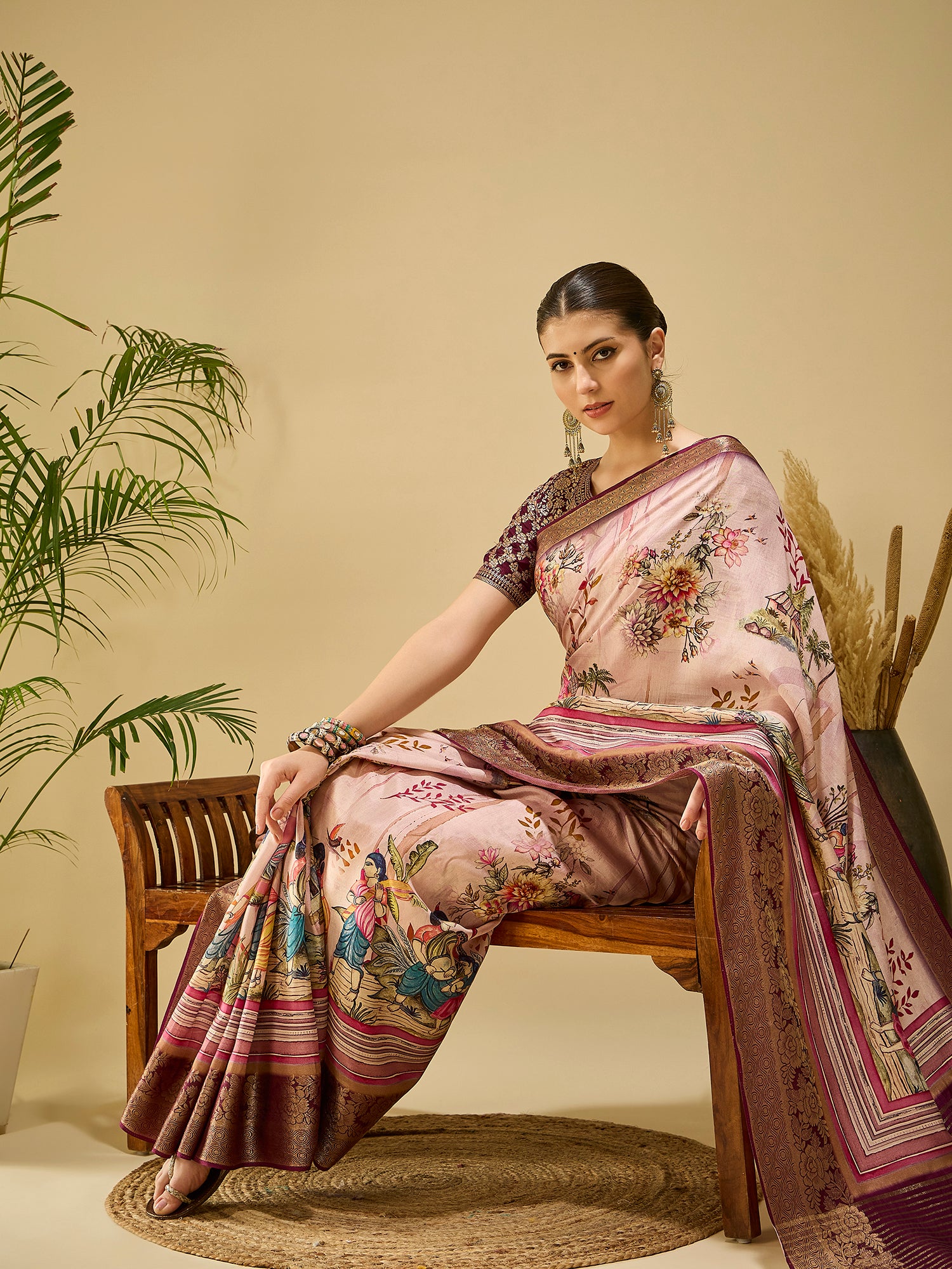 ADHIRA-Elegant blush pink saree with artistic floral and cultural figurine print design