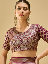 ADHIRA-Elegant blush pink saree with artistic floral and cultural figurine print design