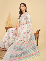 TARANG-Elegant Off-White Floral Printed Linen Saree with Multicolor Woven Border & Tassel Detailing