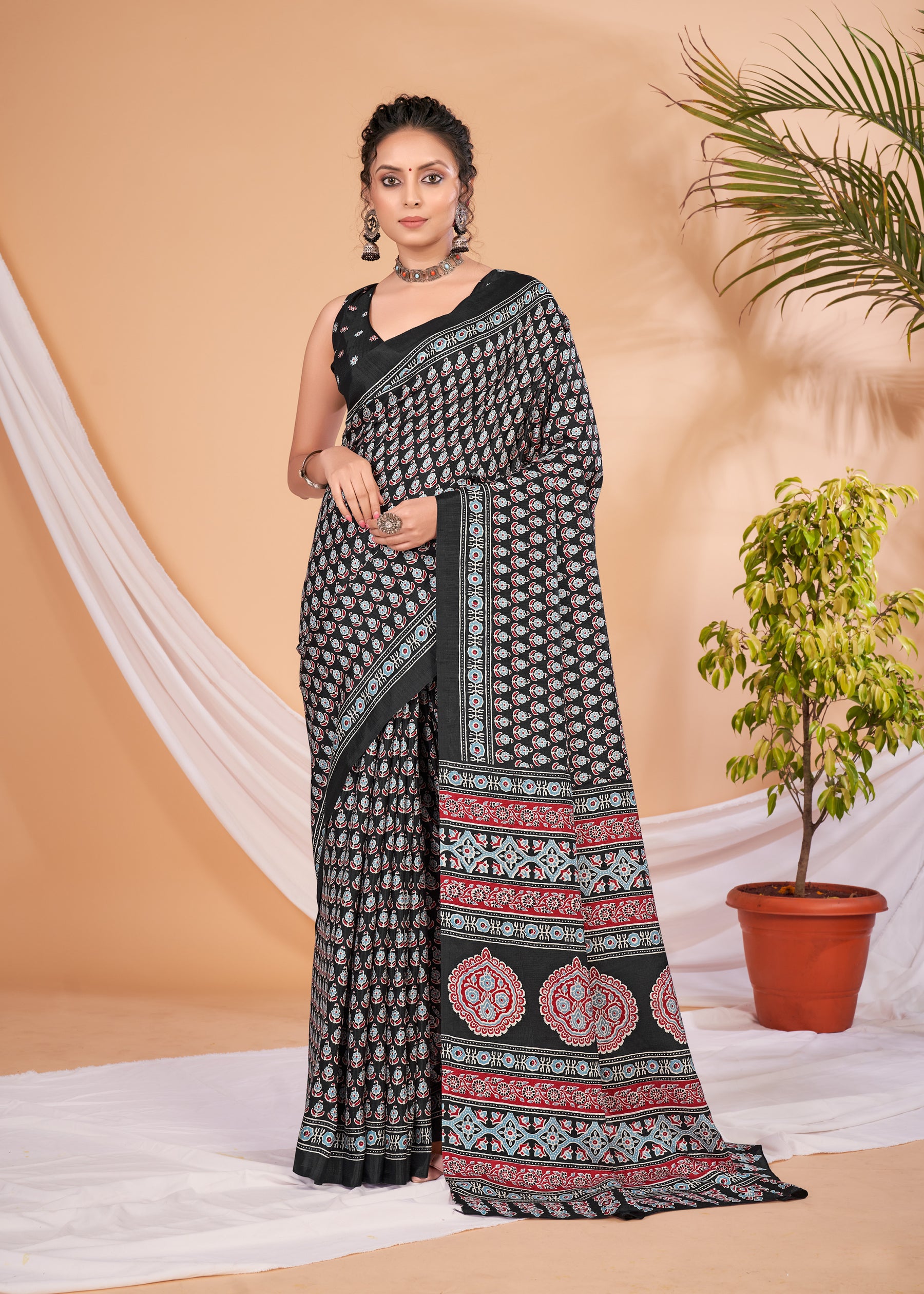 KUMRAN Elegant black saree with intricate traditional floral and geometric print all over