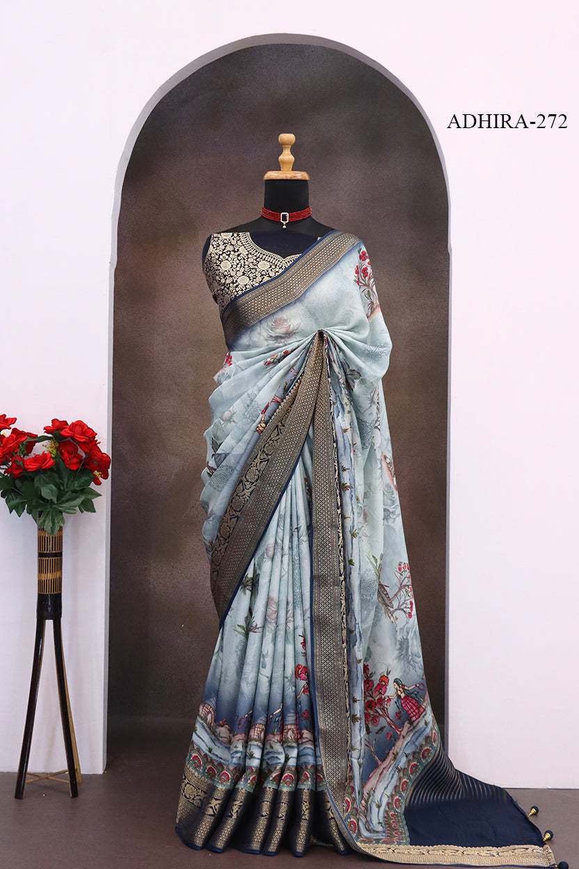ADHIRA-Elegant Powder Blue Floral Printed Saree with Scenic Artistic Motifs, Rich Antique Zari Border and Designer Pallu for Festive & Ethnic Wear