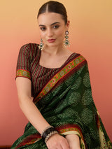 SURTAAL-Elegant dark green saree with intricate floral and nature-inspired prints