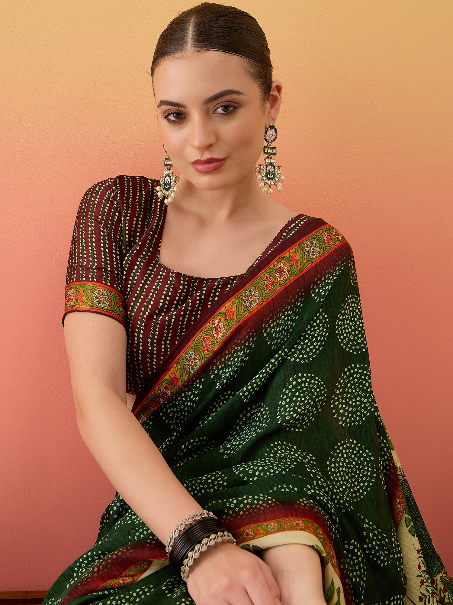 SURTAAL-Elegant dark green saree with intricate floral and nature-inspired prints