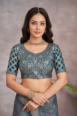 ADHIRA-Elegant Steel Blue Scenic Printed Saree with Antique Gold Zari Border and Designer Black Woven Blouse for Festive & Ethnic Wear