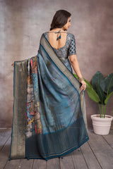 ADHIRA-Elegant Steel Blue Scenic Printed Saree with Antique Gold Zari Border and Designer Black Woven Blouse for Festive & Ethnic Wear
