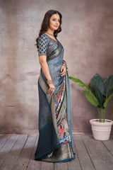 ADHIRA-Elegant Steel Blue Scenic Printed Saree with Antique Gold Zari Border and Designer Black Woven Blouse for Festive & Ethnic Wear
