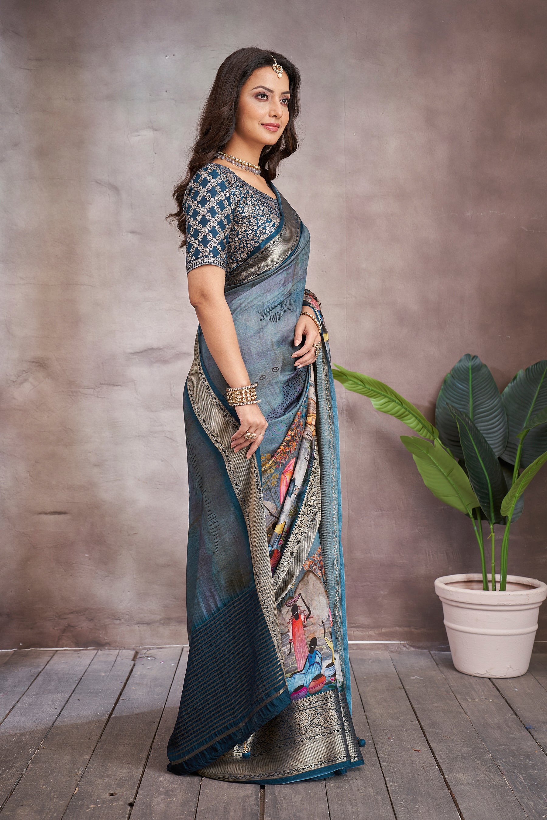 ADHIRA-Elegant Steel Blue Scenic Printed Saree with Antique Gold Zari Border and Designer Black Woven Blouse for Festive & Ethnic Wear
