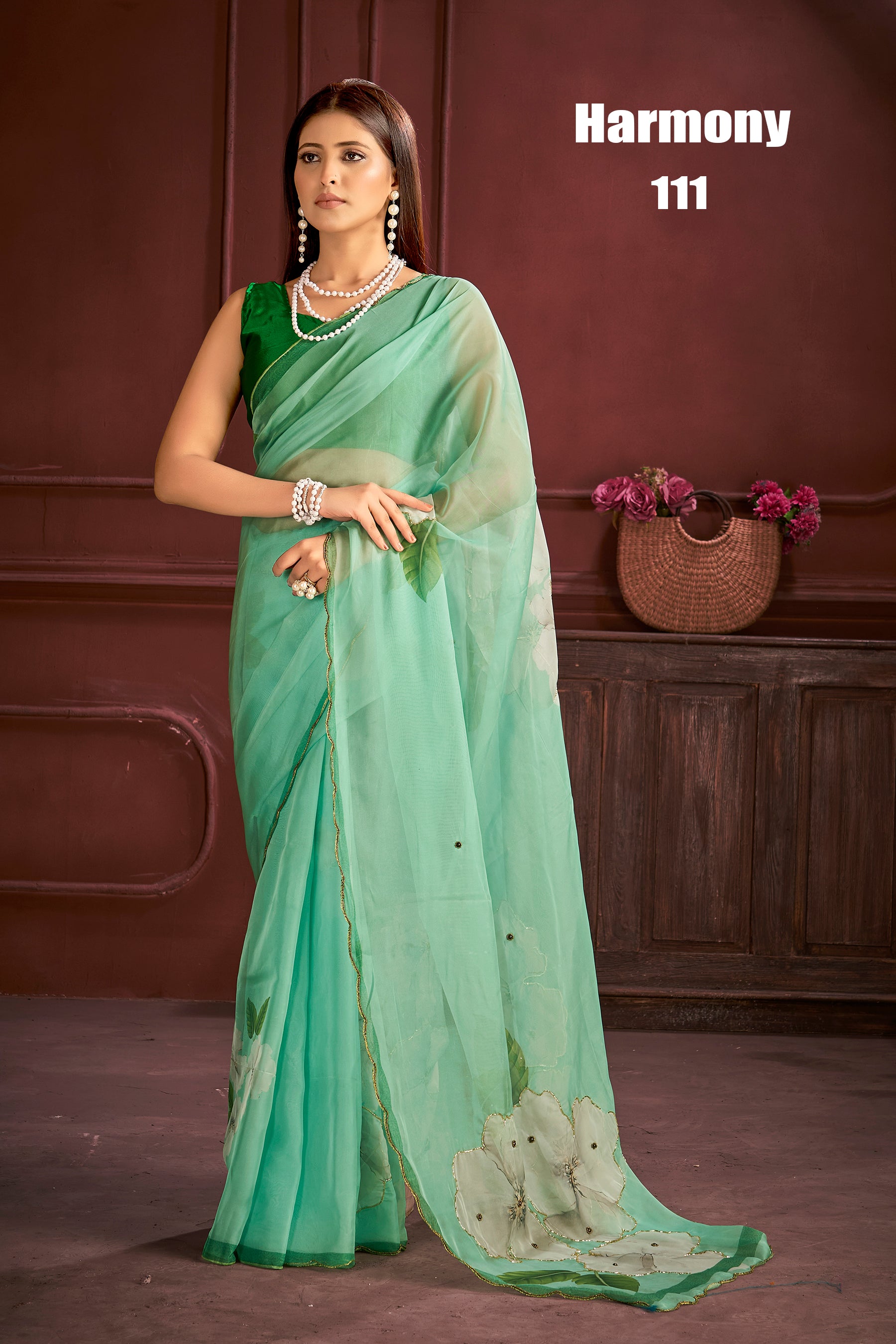 Elegant Mint Green Organza Saree with Floral Appliqué Design