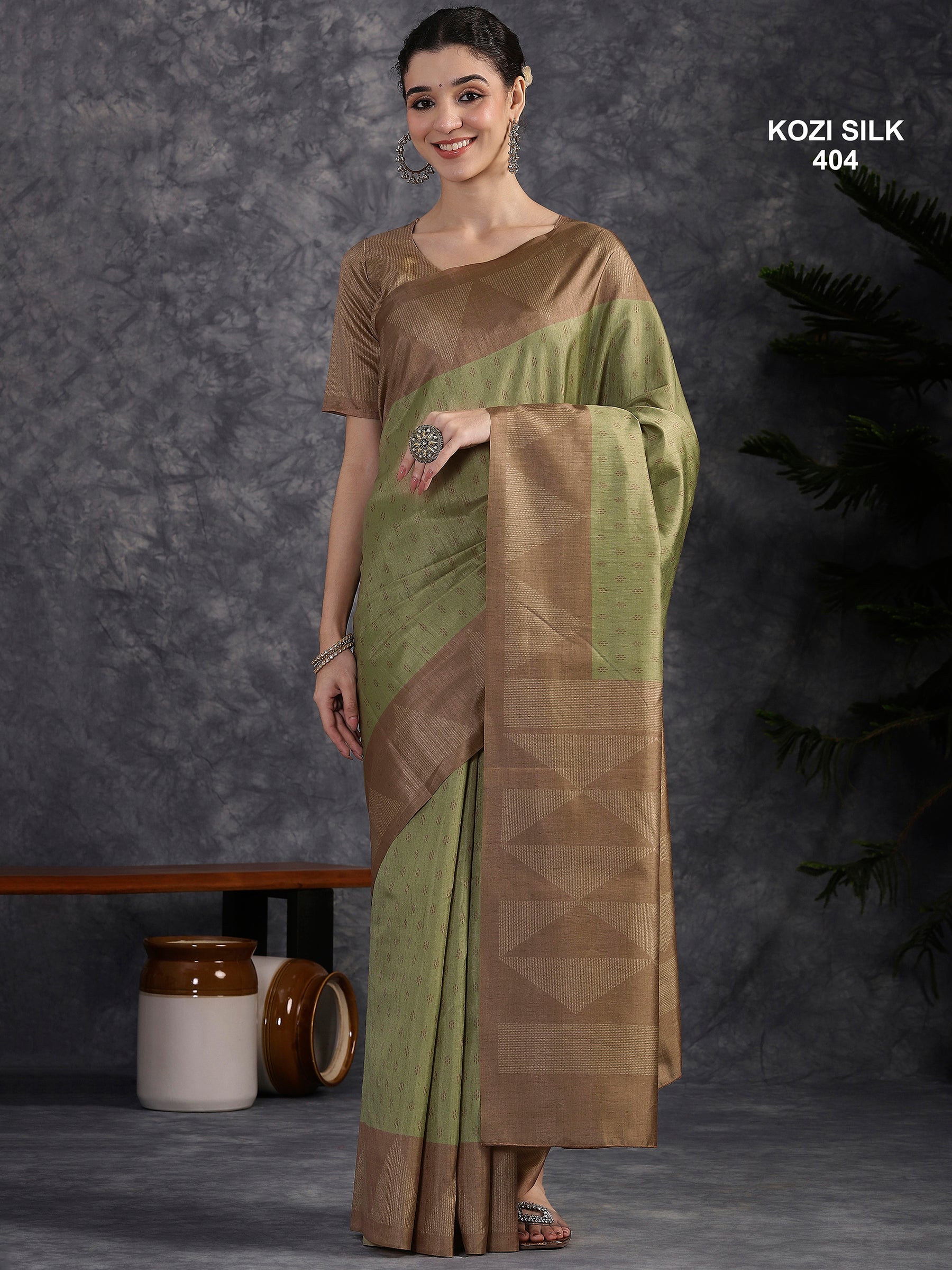 KOZI SILK-Elegant Sage Green Kozi Silk Saree with Copper Zari Geometric Border & Rich Woven Pallu