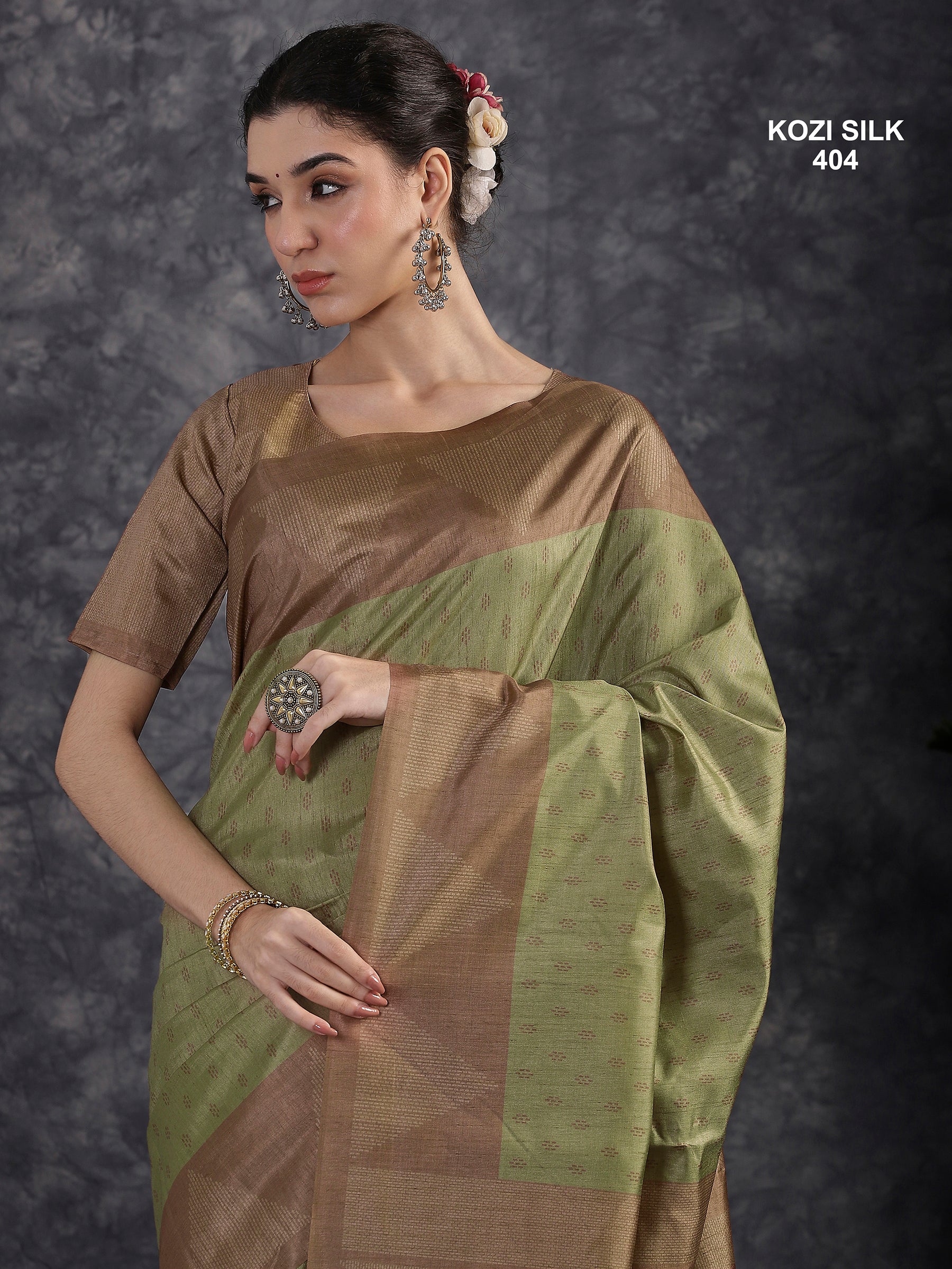 KOZI SILK-Elegant Sage Green Kozi Silk Saree with Copper Zari Geometric Border & Rich Woven Pallu