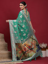 VANAYA-Elegant Emerald Green Silver Zari Saree with Floral Heritage Pallu Tassels