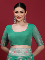 VANAYA-Elegant Emerald Green Silver Zari Saree with Floral Heritage Pallu Tassels