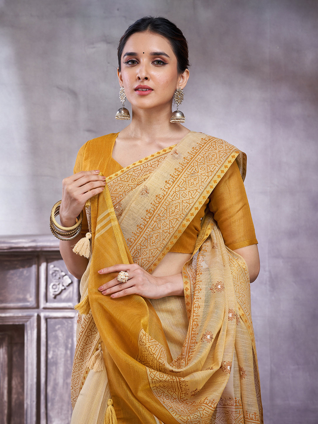 ZARI MAHAL-Elegant Cream Linen Saree with Mustard Yellow Contrast Pallu & Traditional Woven Zari Border Tassels