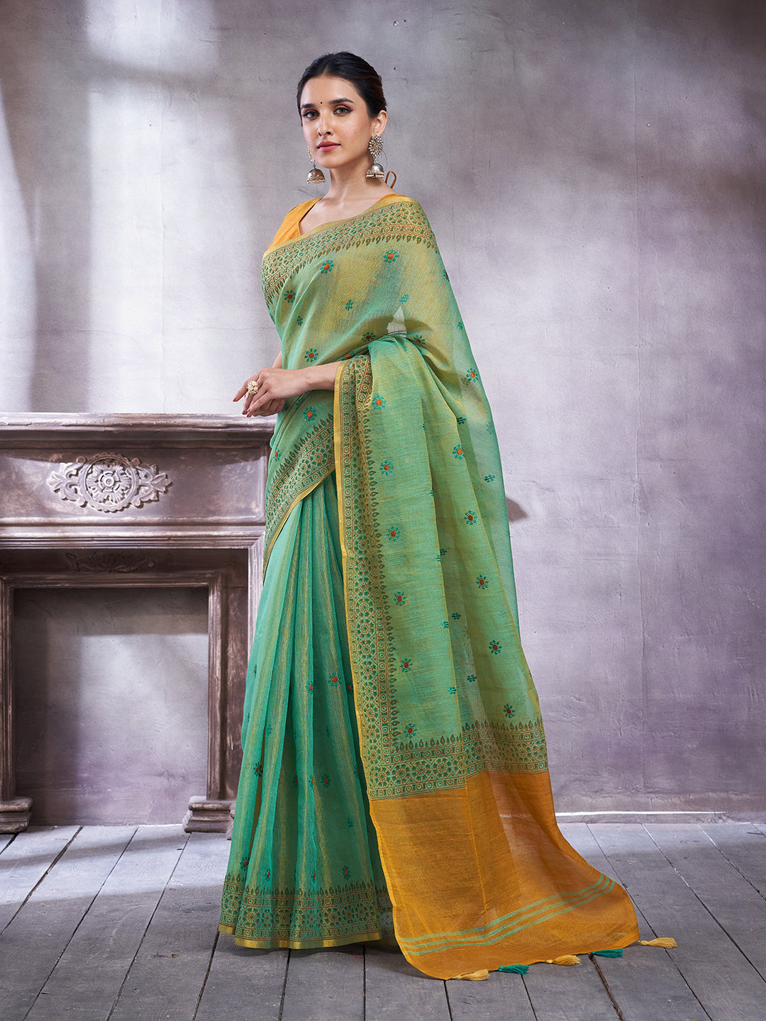 ZARI MAHAL-Elegant Aqua Green Linen Saree with Mustard Gold Contrast Pallu & Intricate Floral Woven Border