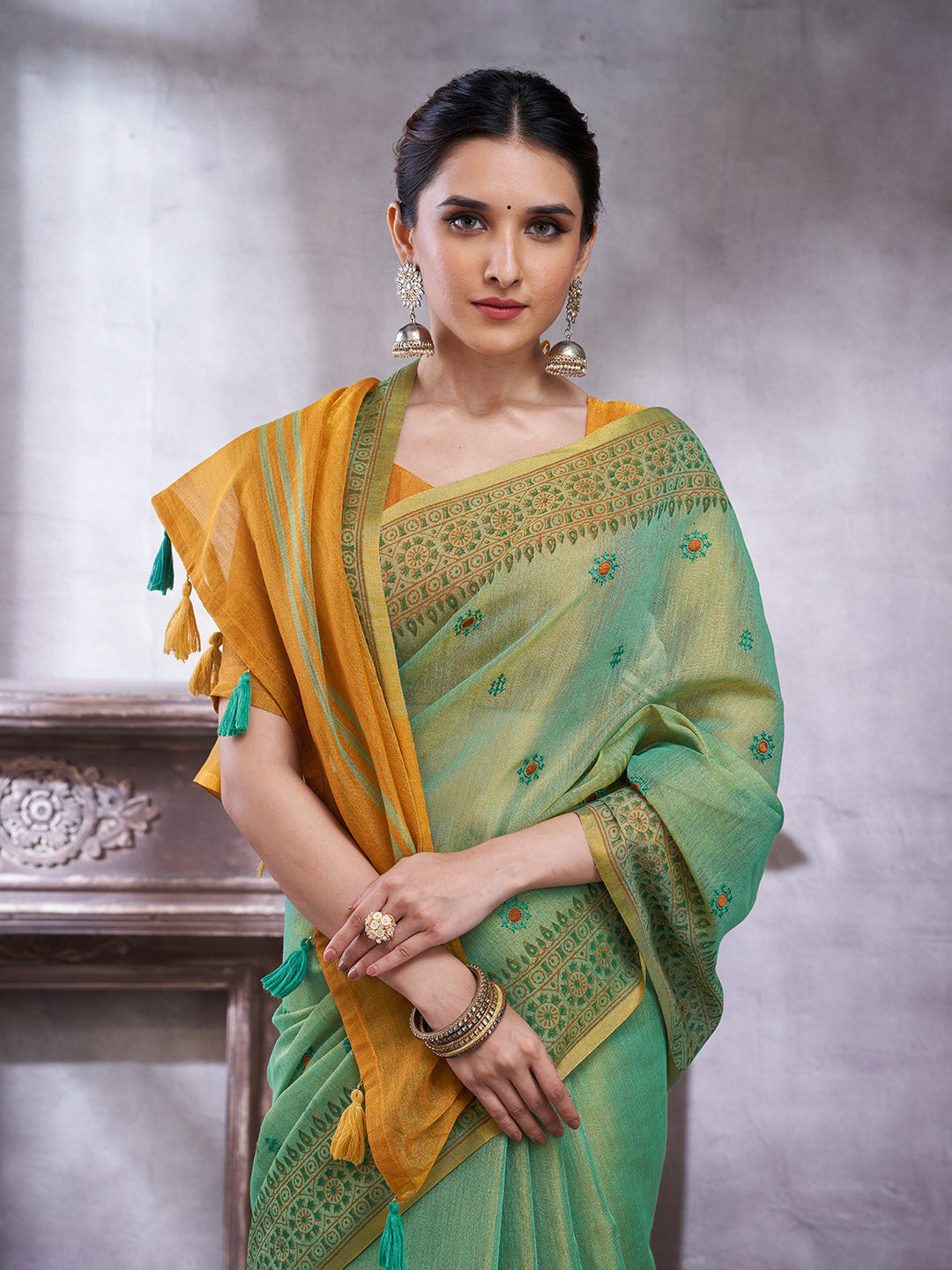ZARI MAHAL-Elegant Aqua Green Linen Saree with Mustard Gold Contrast Pallu & Intricate Floral Woven Border